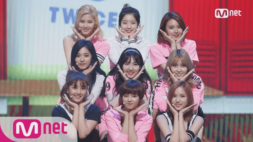 Kpop girl group Twice showing their cute concept in a performance