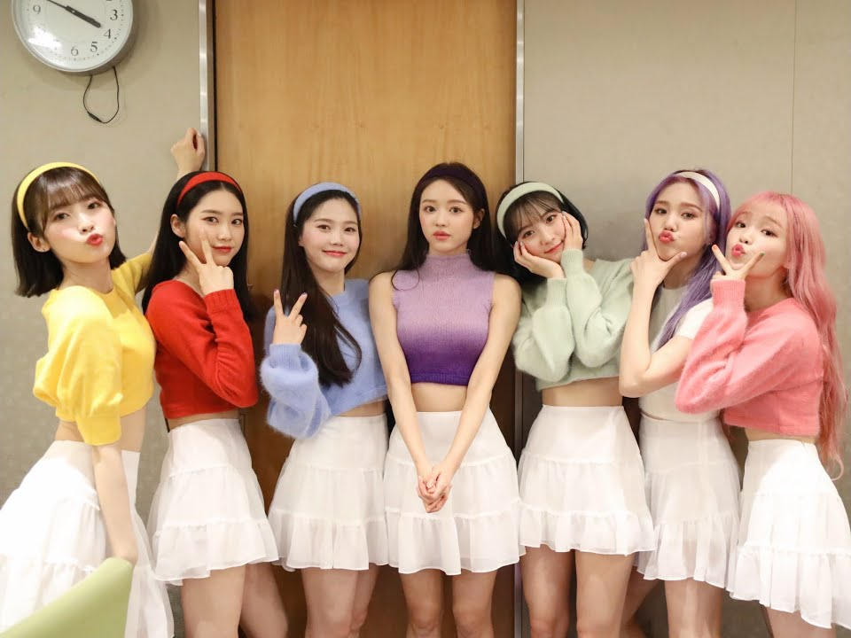 Kpop girl group Oh My Girl wearing cute outfits with a cute facial expression