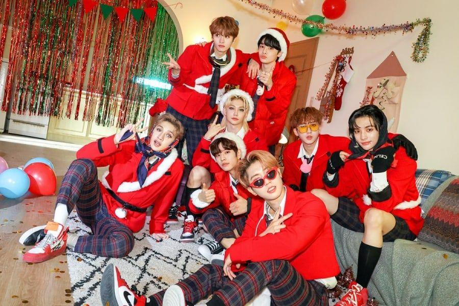 stray kids in christmas clothes for christmas evel music video