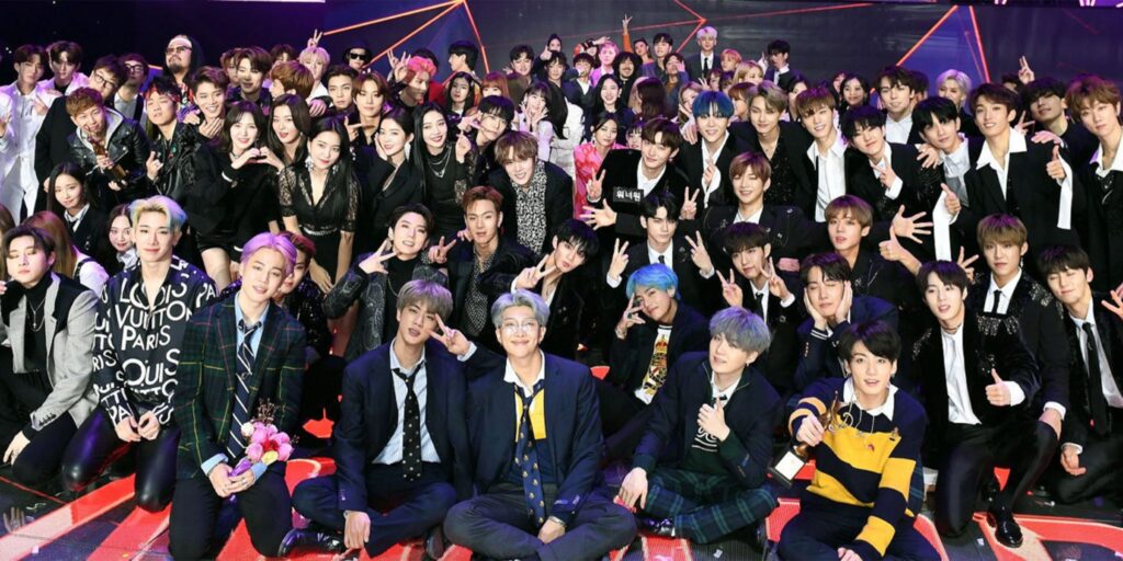 A large group of Kpop Idols on a music show.